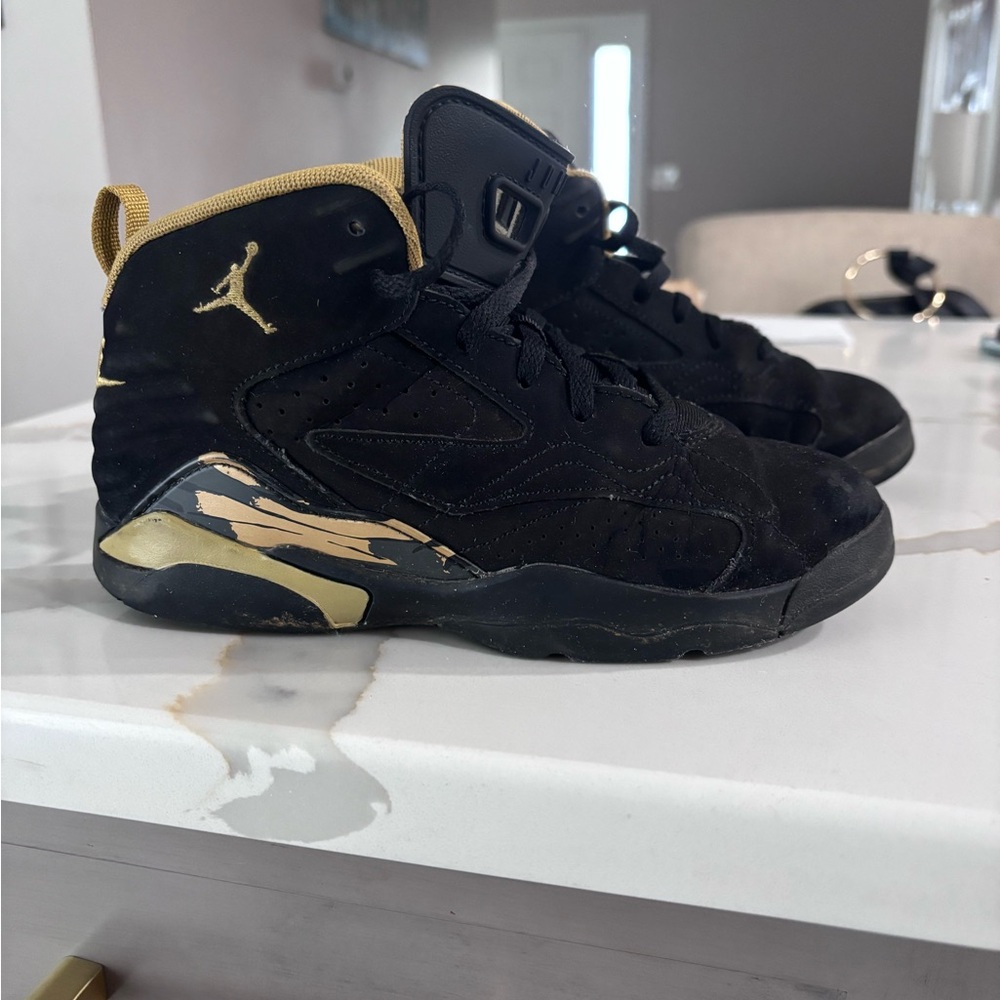 Jordan Black and Gold Sneakers